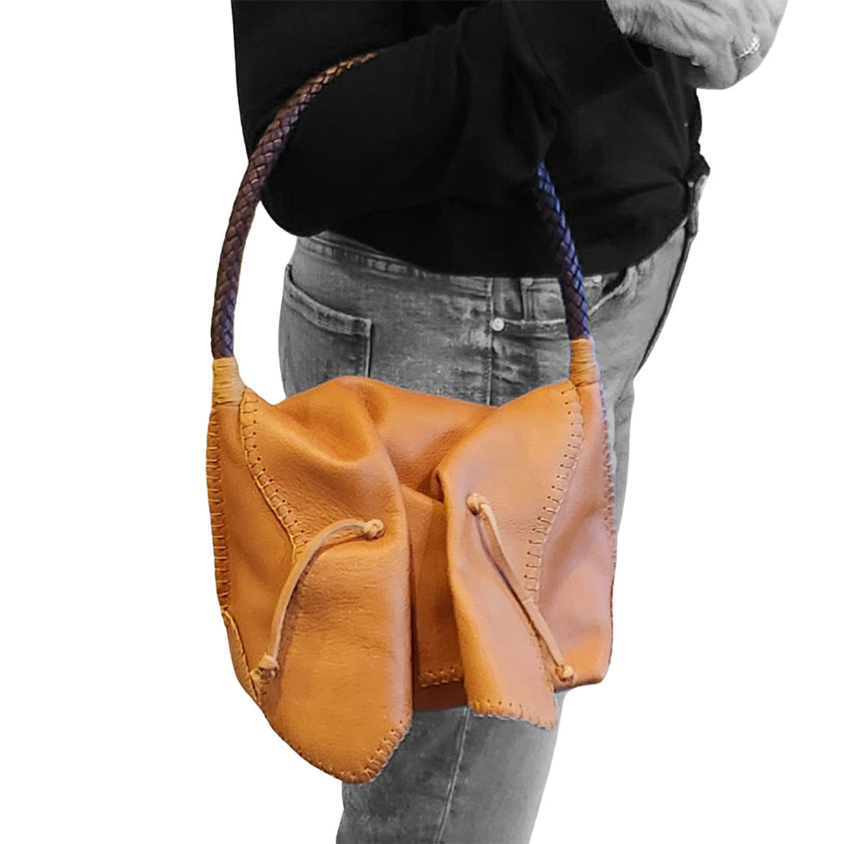 Close-up of the shoulder butterfly bag’s textured leather strap and gold-tone clasp detail from a top-front angle.