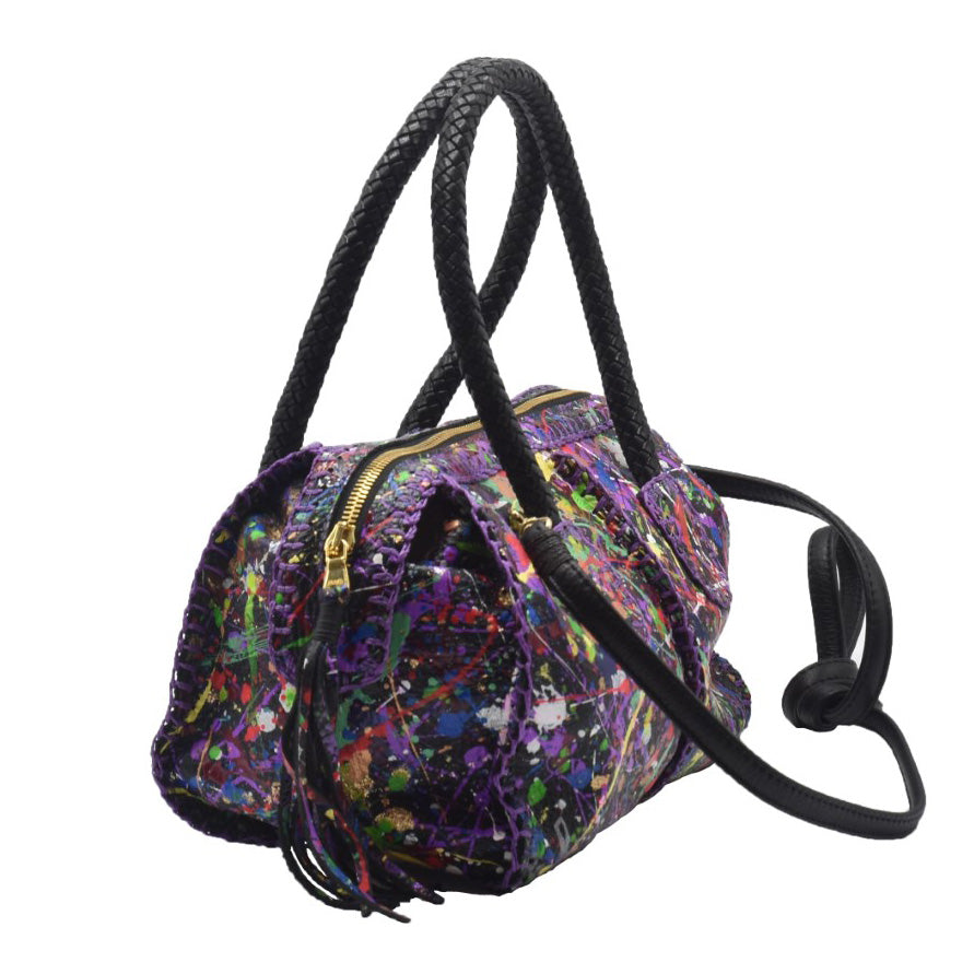 Close-up of the Maybach’s Mini Barrel leather handle with visible fine stitching and textured caramel-brown leather surface.