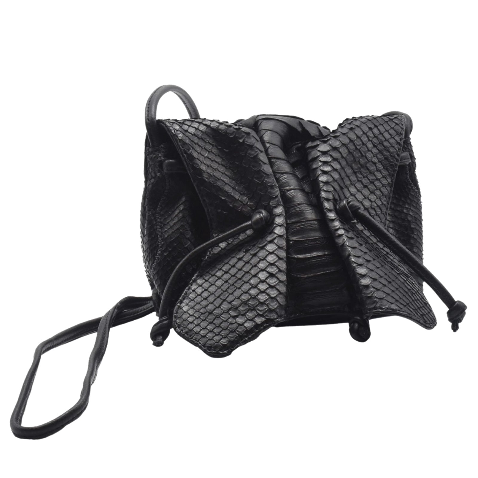 Close-up of the Python Mini Butterfly Bag’s textured crocodile pattern embossed on its top flap and gold-tone clasp detail.