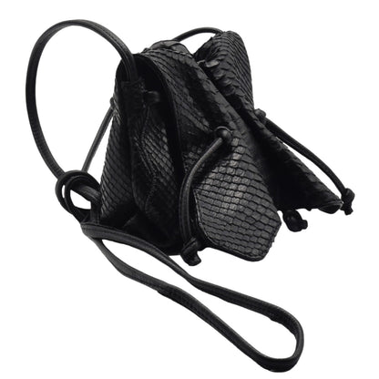 Close-up of the Genuine Python Mini Butterfly Bag’s textured python skin surface and subtle gold hardware accent near the