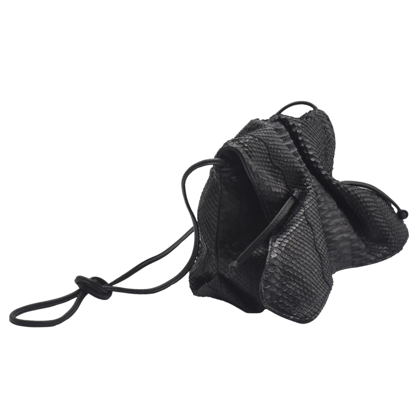 Close-up of the Python butterfly bag’s textured leather surface with intricate natural scales and rich amber hue detail.