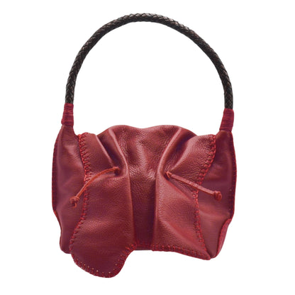 Close-up of the shoulder butterfly bag’s textured faux leather surface with visible stitching and subtle embossed logo