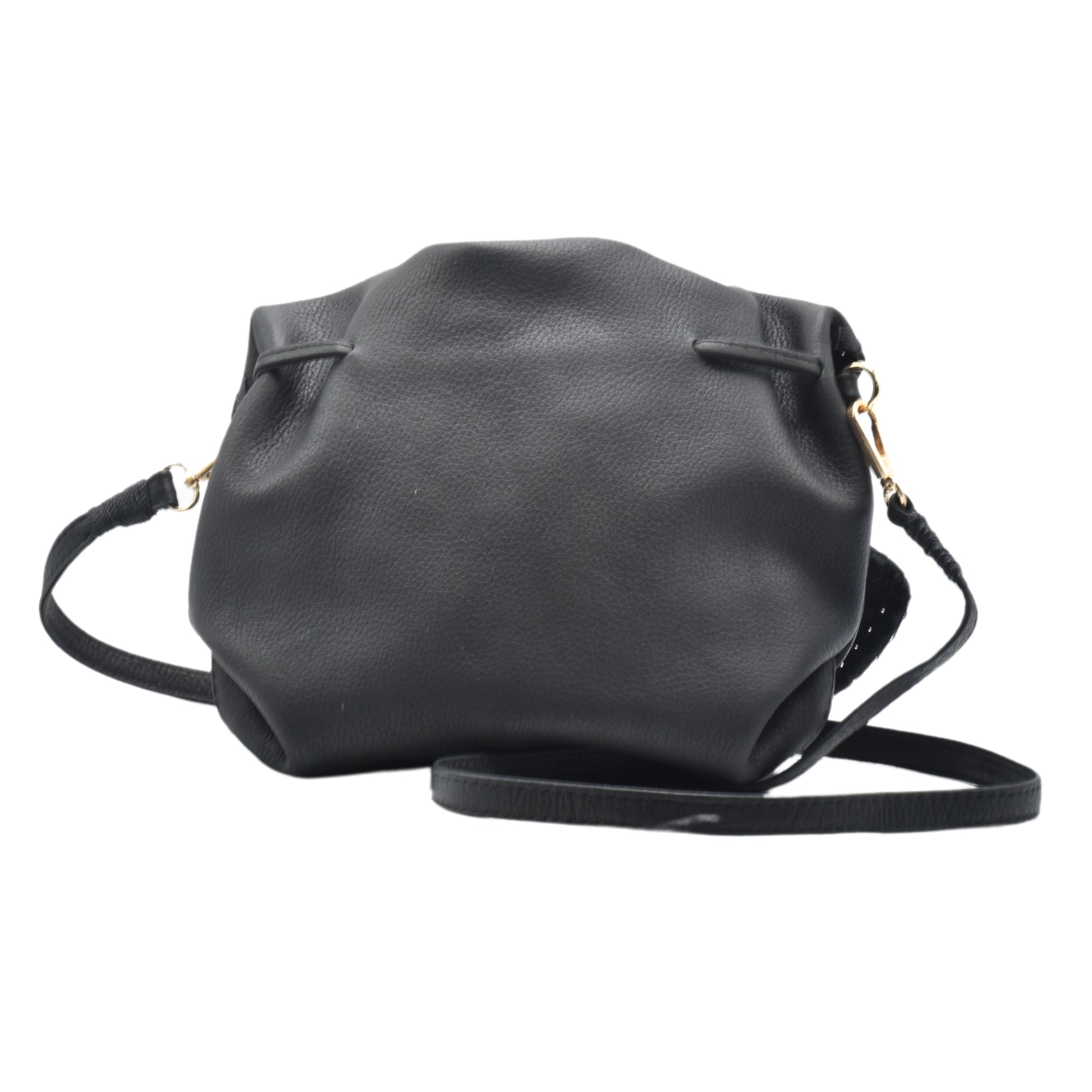 Close-up of the Butterfly Bag’s textured faux leather surface with subtle stitching detail and vibrant teal color from a