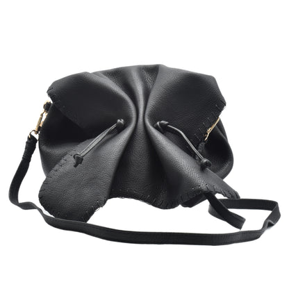 Carlos Falchi Butterfly Bag crafted from black textured leather with gold-tone hardware and a adjustable shoulder strap