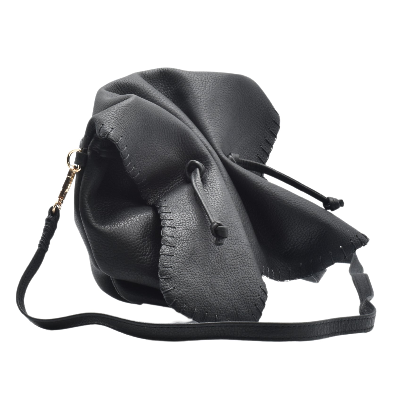 Close-up of the Butterfly Bag’s textured leather surface with vibrant magenta and purple hues, highlighting intricate