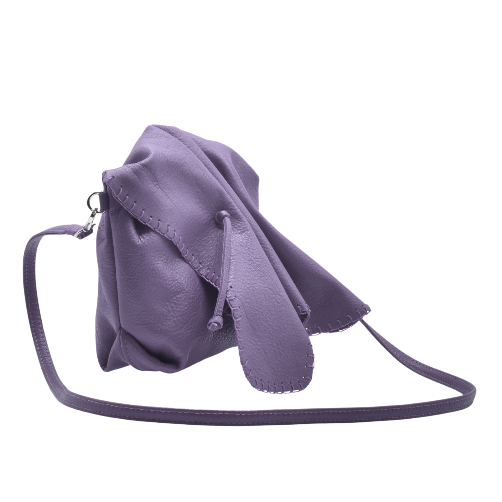 Close-up of the Butterfly Bag’s vibrant multicolored floral fabric exterior with detailed stitching and textured surface.