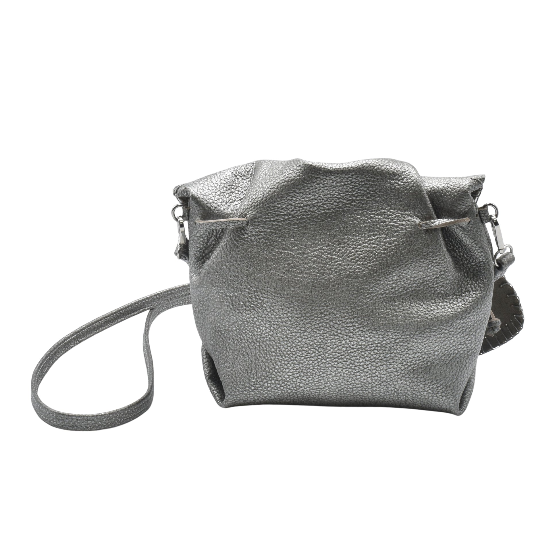 Close-up of textured purple butterfly-shaped bag with stitched edges and small gold zipper pull detail.