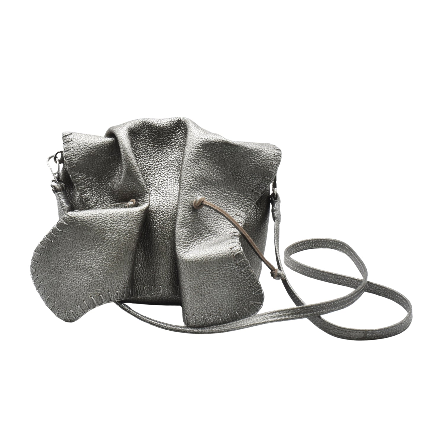 Close-up of textured pink leather surface with intricate floral embossed pattern on Butterfly Bag, showcasing detailed