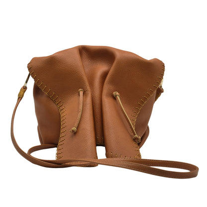 Close-up of the Butterfly Bag’s textured faux leather surface with a focus on the embossed floral pattern and stitching