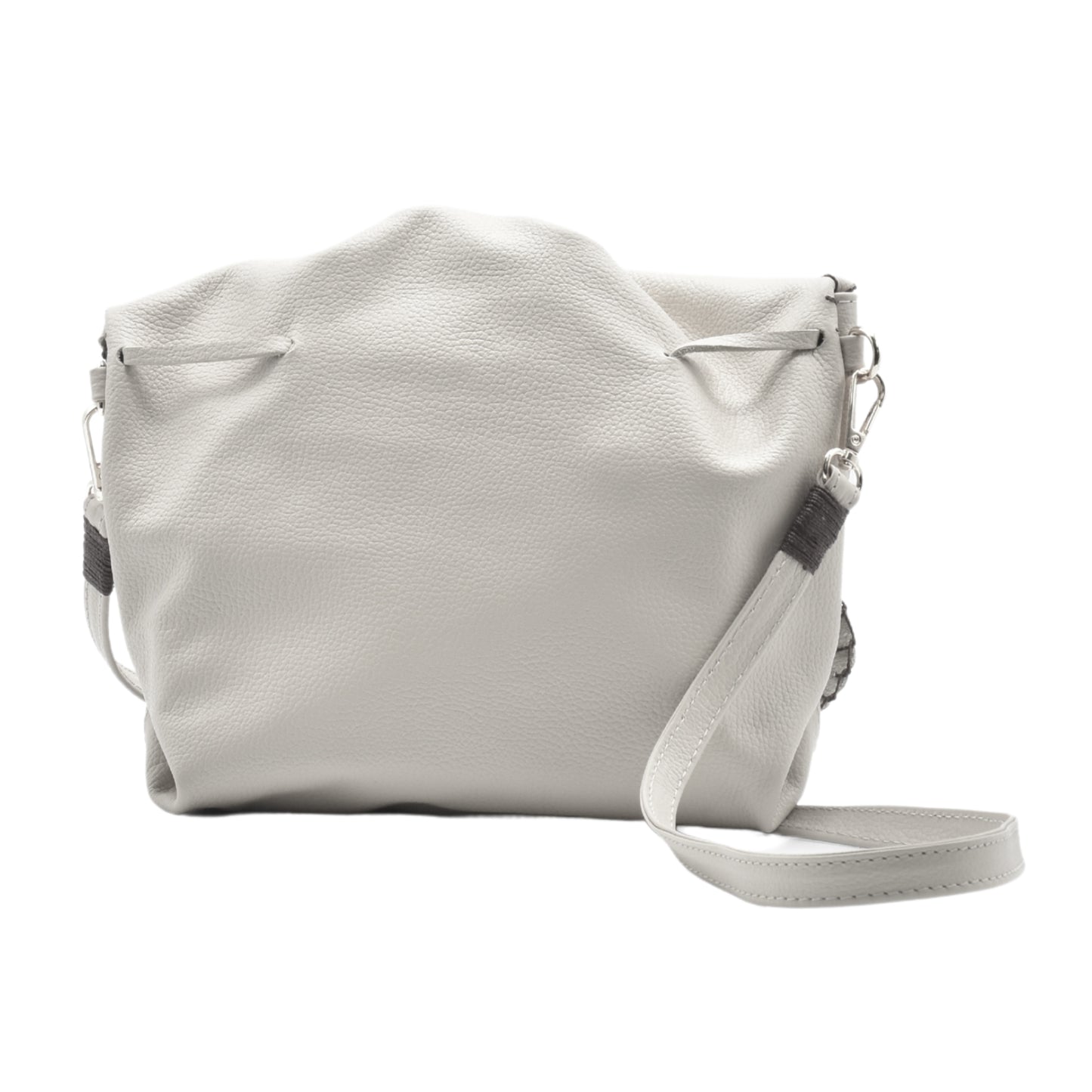 Close-up of the Butterfly Bag’s textured pink faux leather surface with subtle stitching details and a partial view of the