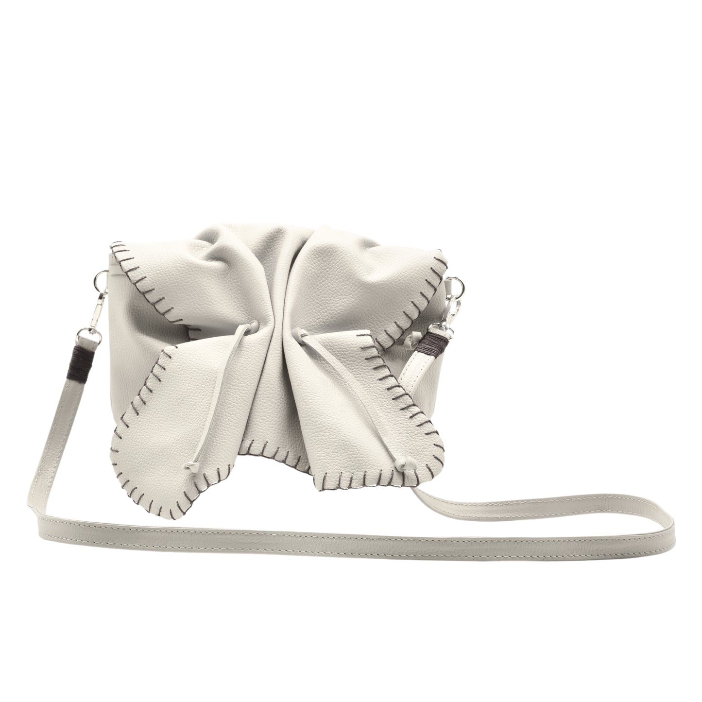 Close-up of the Butterfly Bag's textured faux leather surface with embossed floral pattern and gold-tone zipper pull detail.