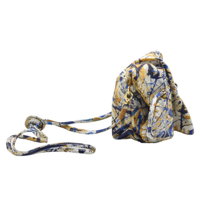 Close-up of the Mini Butterfly Bag's textured leather surface with gold-tone logo hardware and zipper pull detail.