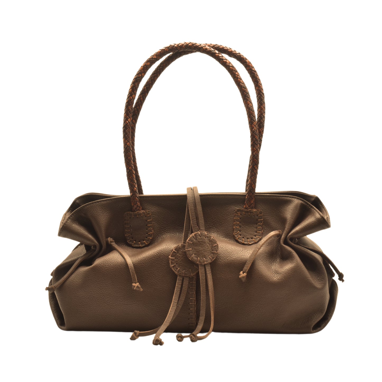 Close-up of textured pebbled leather handle with gold-tone hardware on signature satchel, displaying detailed stitching and