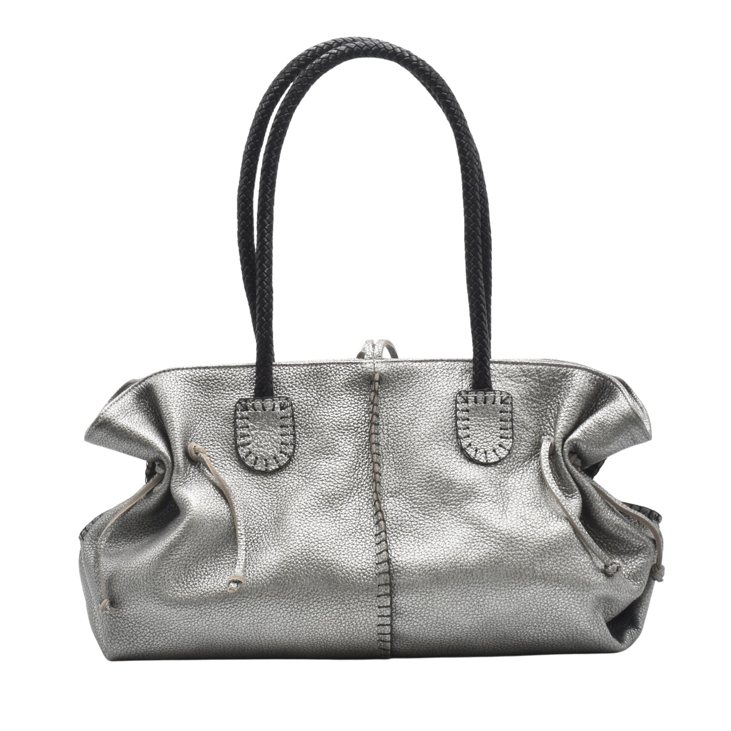 Close-up of textured pebbled leather handle with gold-tone hardware on the Signature Satchel from an upper-left angle.