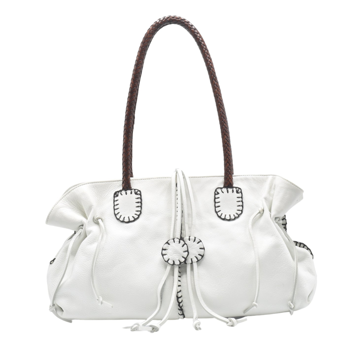 Close-up of textured pebble-grain leather handle detail with reinforced stitching on the Signature Satchel.