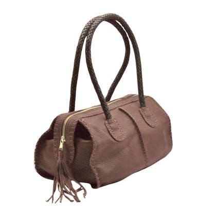 Close-up of the textured oak barrel wood surface highlighting rich grain patterns and handcrafted finish details.