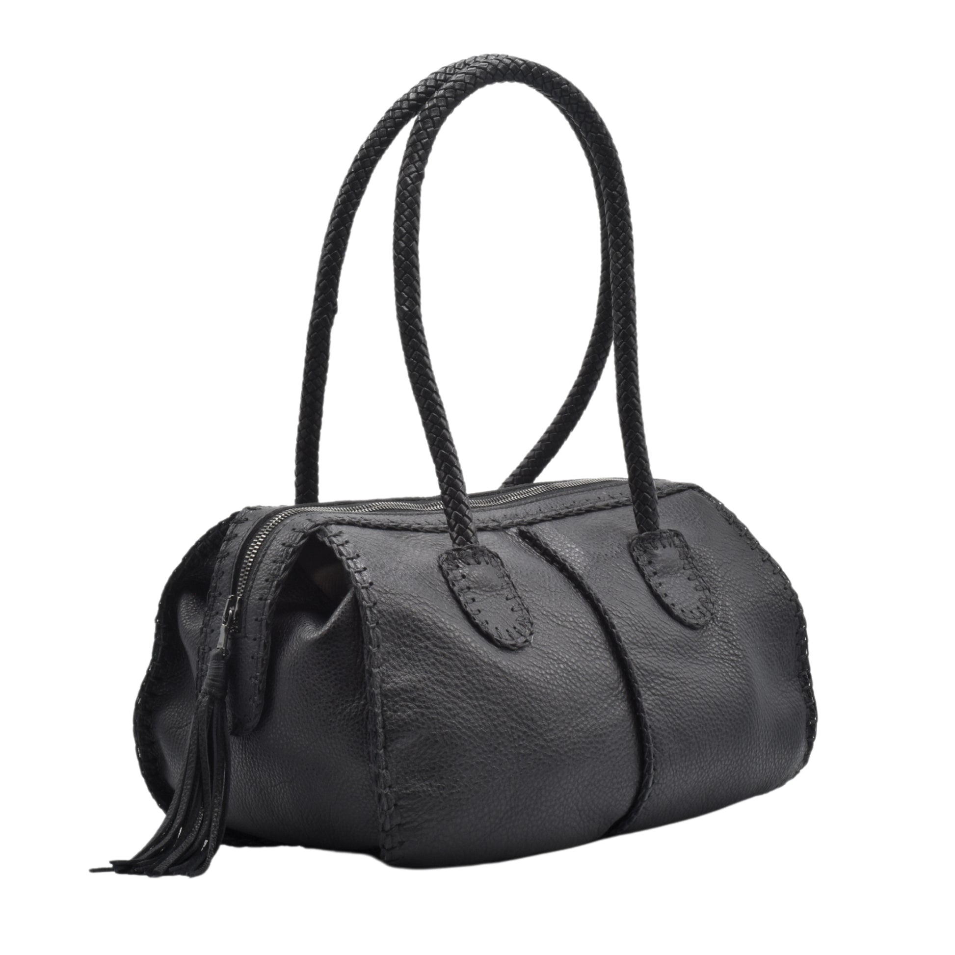 Close-up of the textured, matte wood surface with visible grain and subtle carvings on the barrel's side.