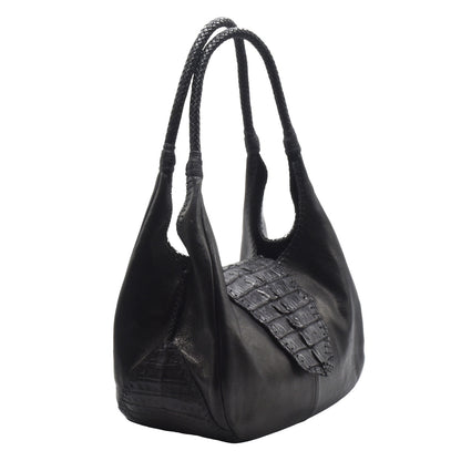 Close-up of the Croc Hobo’s textured woven straw material with leather strap detailing and silver buckle accents.