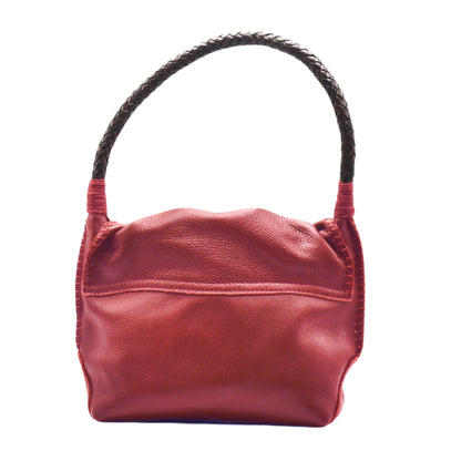 Close-up of the shoulder butterfly bag’s textured faux leather surface with visible stitching and subtle embossed logo