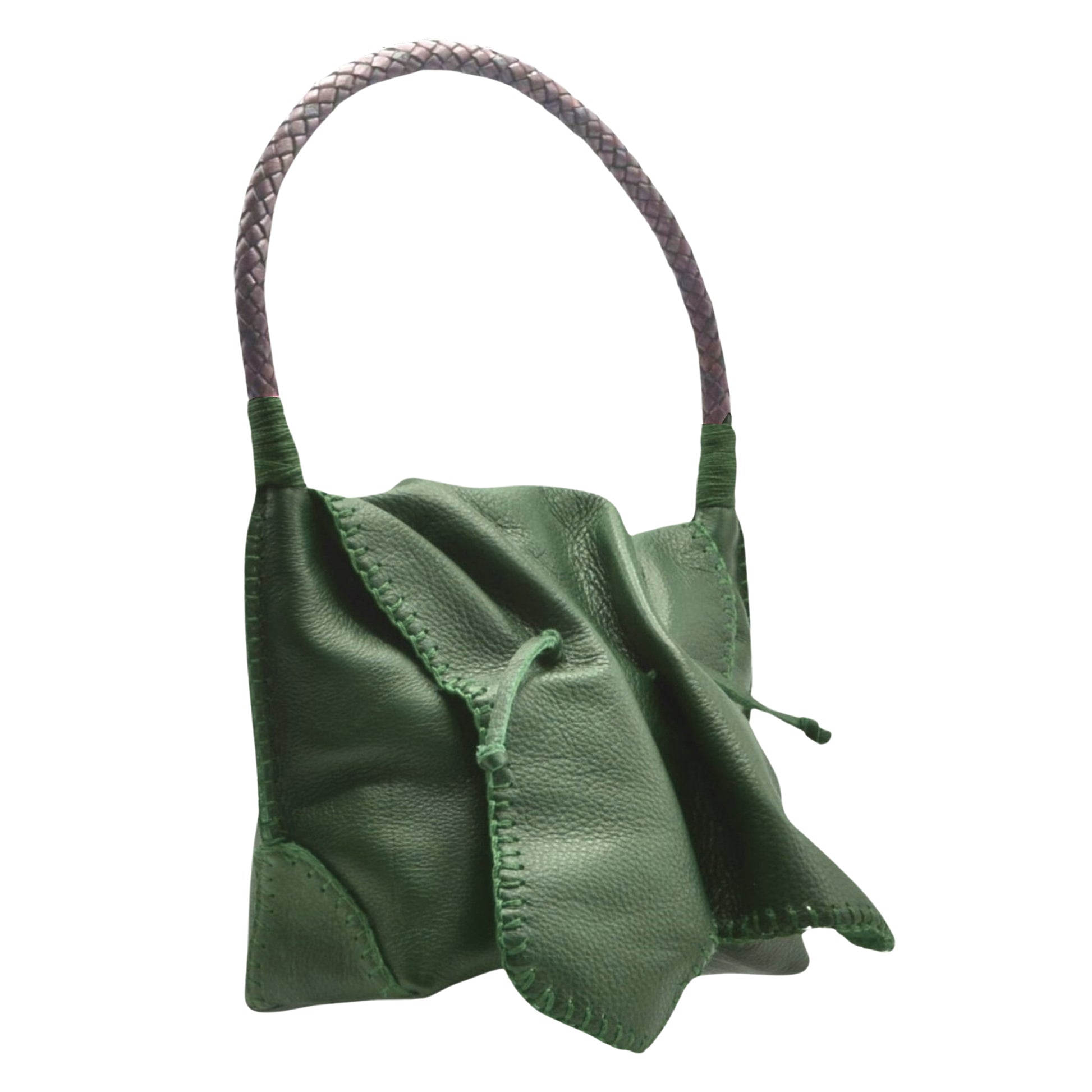 Close-up of the Shoulder Butterfly Bag’s textured leather surface with gold chain strap detailing and subtle stitching