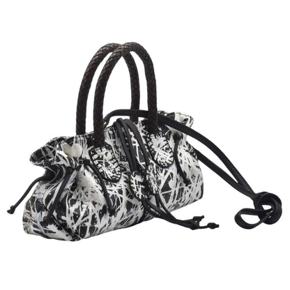 Close-up of the Maybach's Mini Satchel showing textured black leather surface and gold-tone zipper detail at the top.