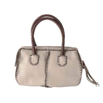 Close-up of the textured oak wood surface showcasing natural grain patterns and warm amber tones of The Classic Barrel.