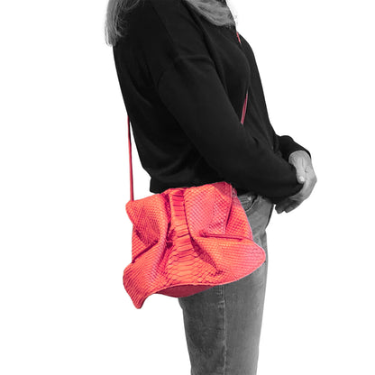 Close-up of the Butterfly Bag's textured, lavender fabric handle with stitched edging and small gold-tone zipper pull detail.