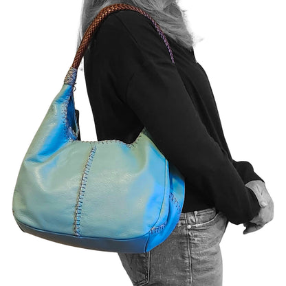 Close-up of the Jumper Maybach's Iconic Hobo's textured woven fabric and leather handle details from a front angled