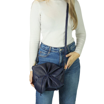 Close-up of the buttery lambskin texture with subtle natural grain and soft sheen highlighting its supple, smooth finish