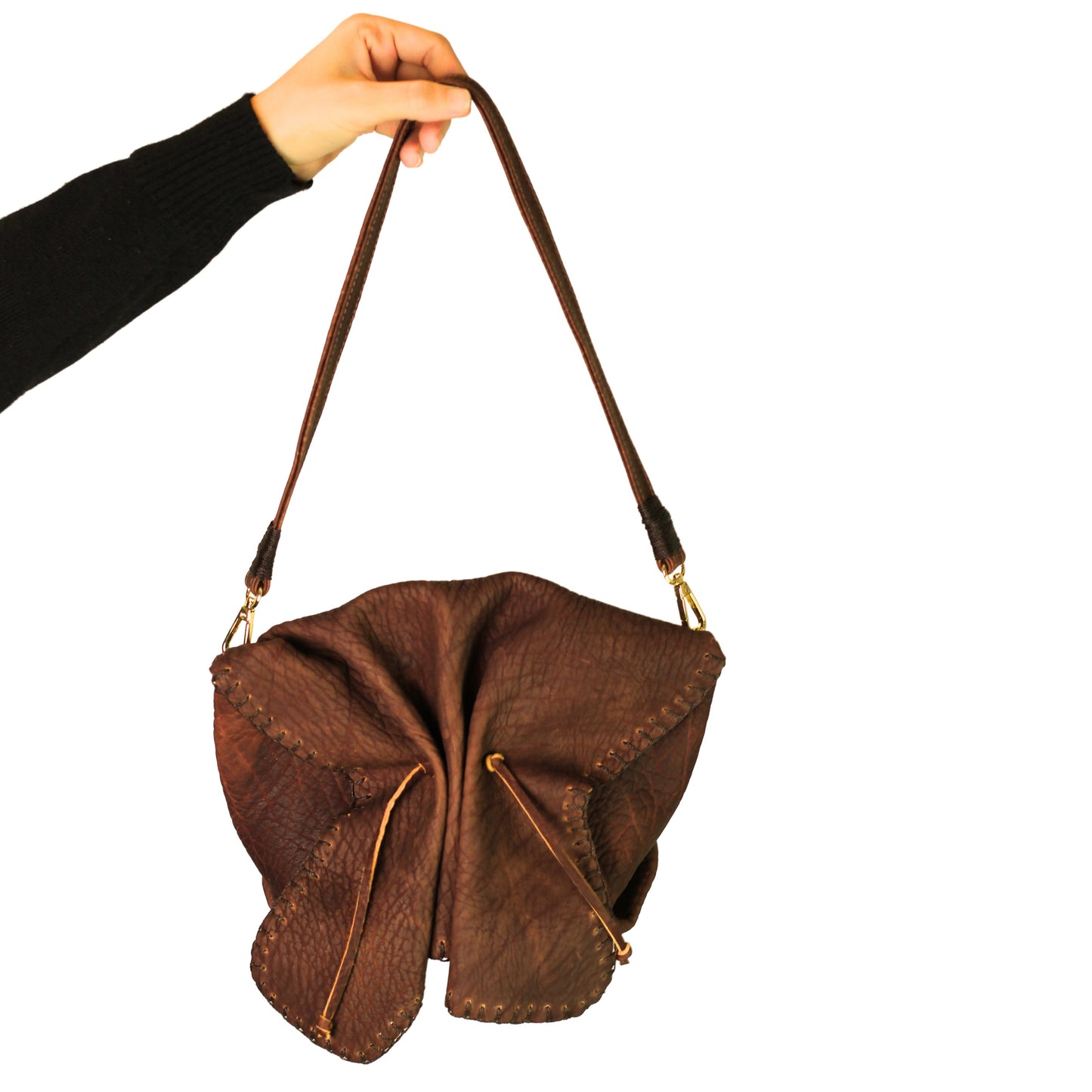 Close-up of the butterfly-shaped lambskin texture highlighting soft, supple surface and intricate stitching details at a