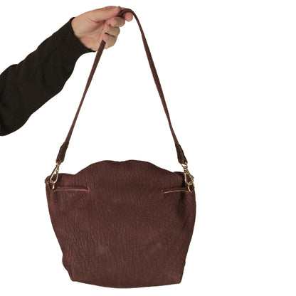 Close-up of the Butterfly Bag Lambskin's textured leather surface highlighting fine grain and subtle sheen from a top-down