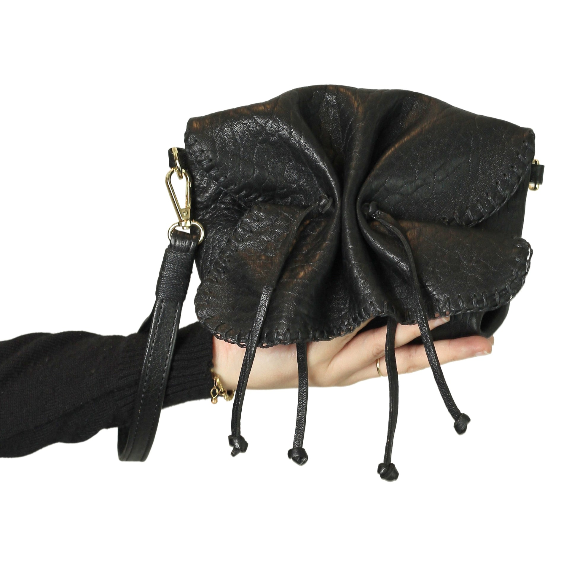 Close-up of the Mini Butterfly Bag Lambskin's textured surface showcasing delicate stitching and soft sheen detail from a