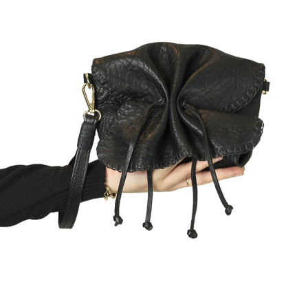 Close-up of the Mini Butterfly Bag Lambskin's textured surface showcasing delicate stitching and soft sheen detail from a