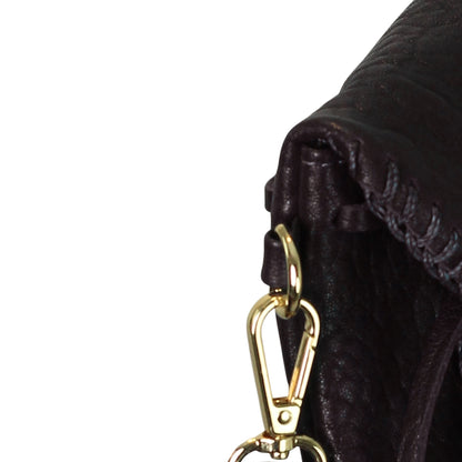 Close-up of the Mini Butterfly Bag Lambskin's textured leather surface with subtle grain details and light reflections