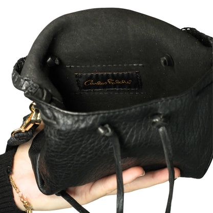 Close-up of the Mini Butterfly Bag’s lambskin leather texture with delicate stitching and subtle sheen highlighting