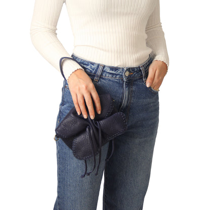 Close-up of the Mini Butterfly Bag's lambskin surface highlighting soft, textured material with subtle stitching details.