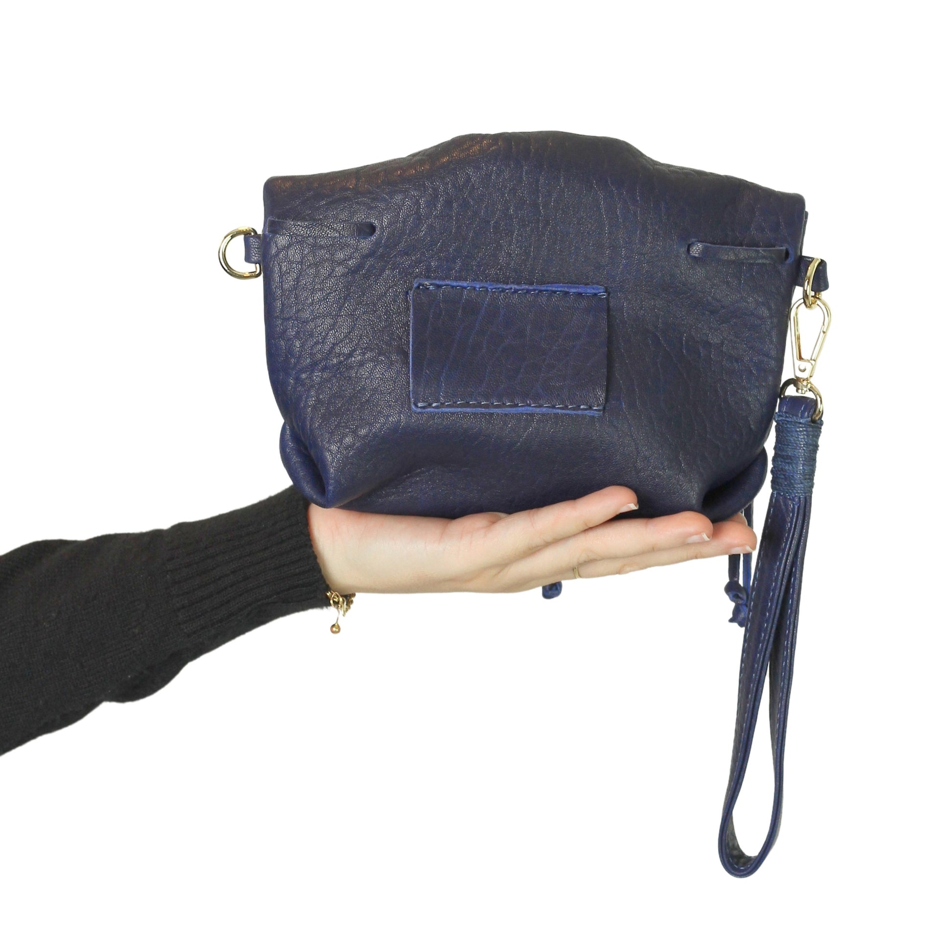 Close-up of the Mini Butterfly Bag's textured lambskin surface highlighting delicate butterfly embroidery and fine stitching