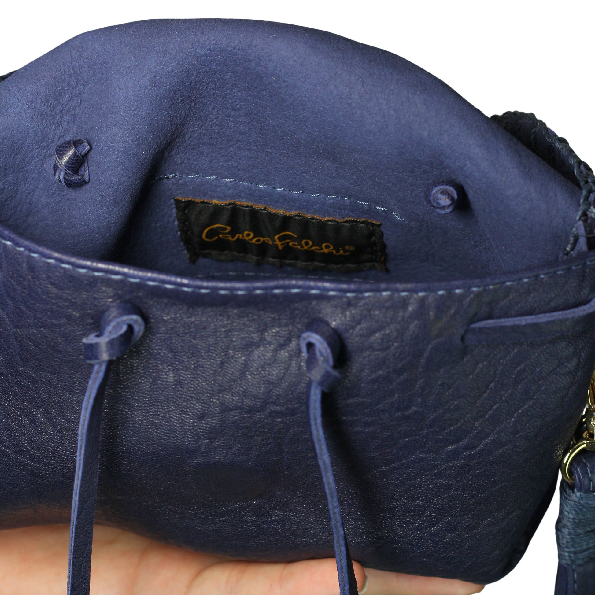 Close-up of the Mini Butterfly Bag's soft lambskin texture and delicate butterfly-shaped clasp detail from a slightly angled