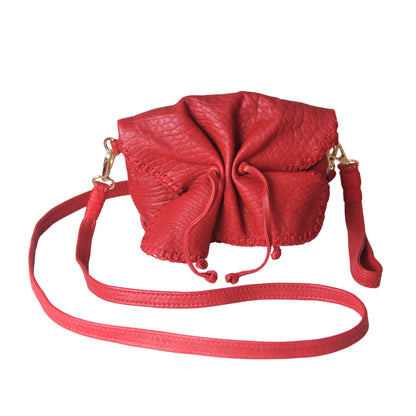 Close-up of the mini butterfly bag’s lambskin texture highlighting its soft, smooth surface and delicate craftsmanship from