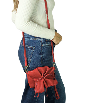 Close-up of the Mini Butterfly Bag’s lambskin texture highlighting fine grain and soft sheen from a top-front angle.