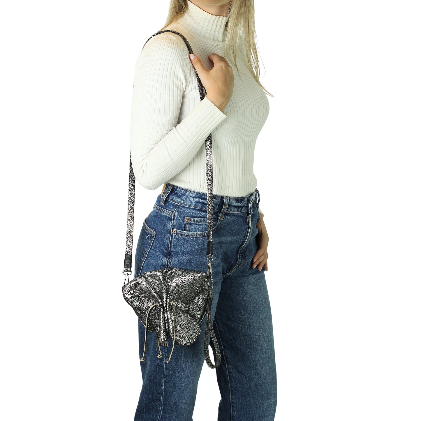 Close-up of the Mini Butterfly Bag's soft lambskin texture and delicate butterfly charm detailing from a front angled view.