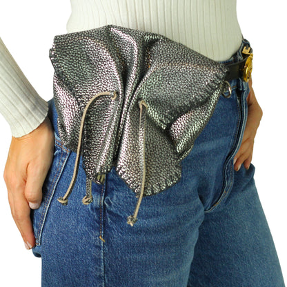 Close-up of the Mini Butterfly Bag’s soft lambskin texture with subtle stitching details and a hint of the gentle top handle