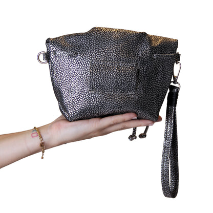 Close-up of the Mini Butterfly Bag Lambskin’s textured leather surface and delicate butterfly-shaped zipper pull detail.