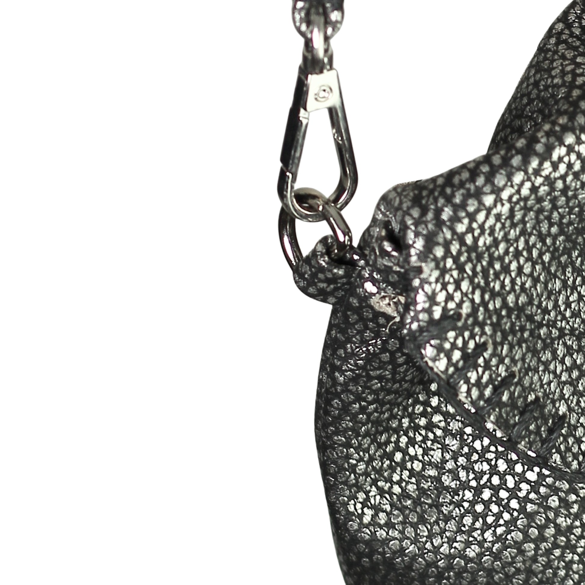 Close-up of the mini butterfly bag’s lambskin handle featuring delicate stitching and smooth, supple texture at a subtle