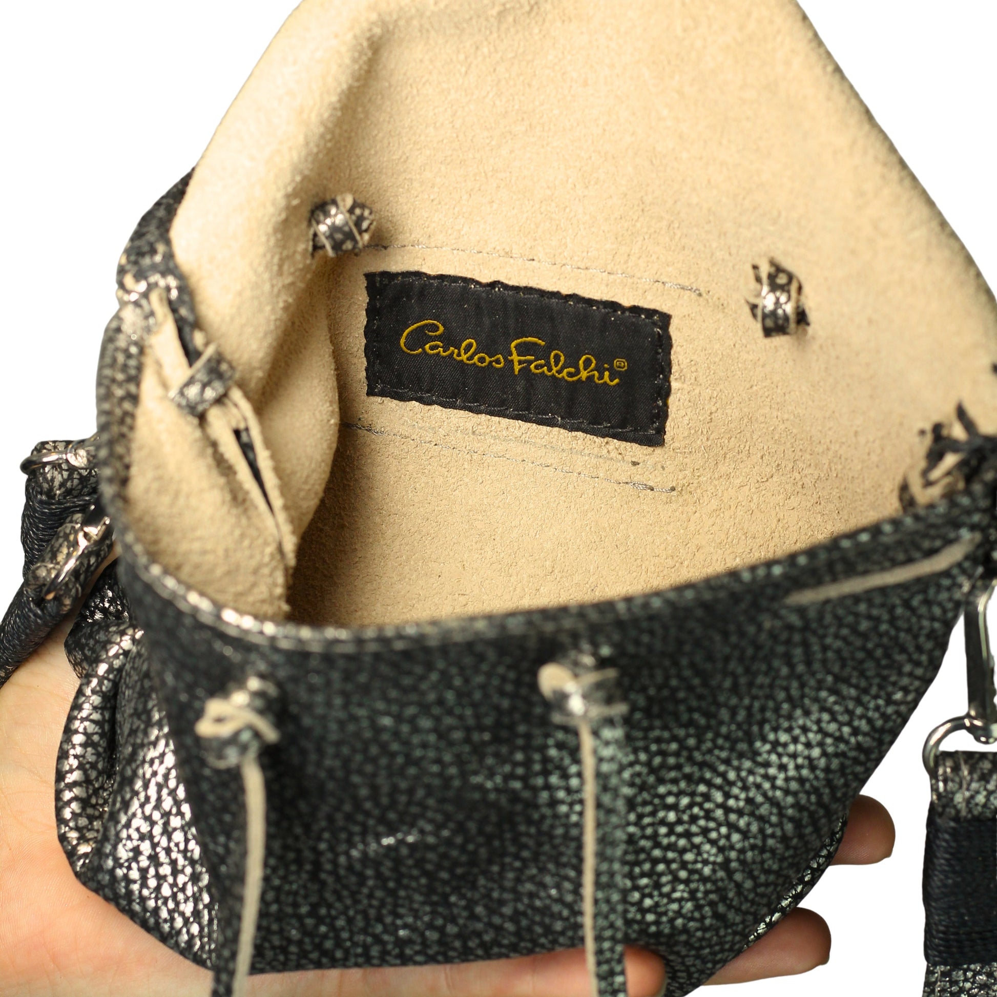 Close-up of the Mini Butterfly Bag Lambskin’s textured leather surface revealing delicate stitching and subtle sheen from a