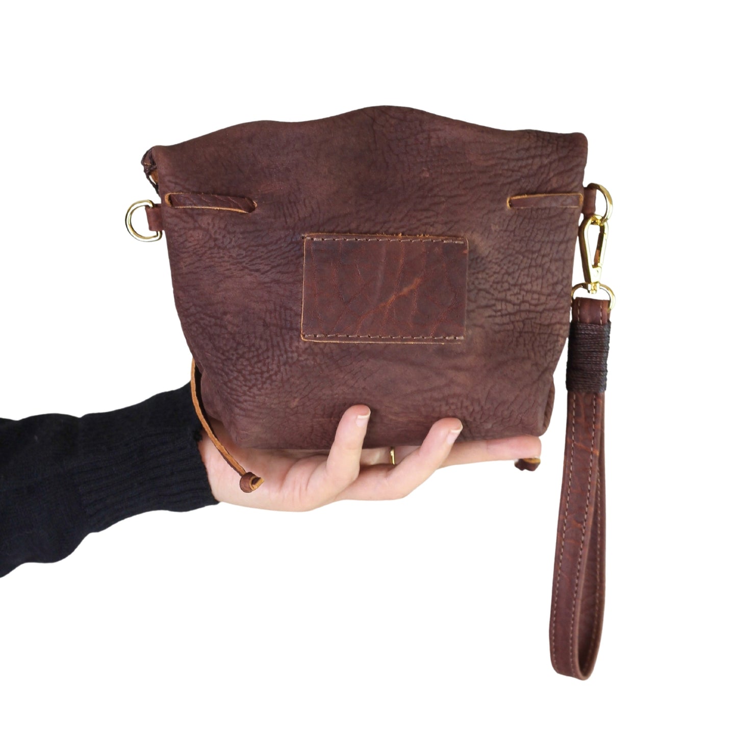 Close-up of the Mini Butterfly Bag Lambskin’s textured surface and delicate stitching detail from a slightly angled top view