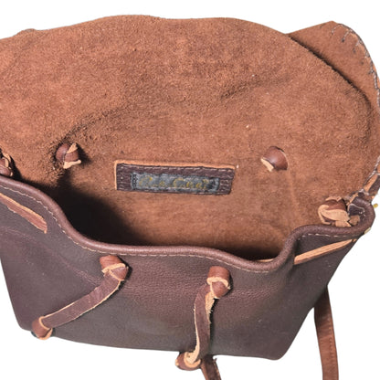 Close-up of the Mini Butterfly Bag’s lambskin textured surface highlighting fine grain detail from a slightly angled top