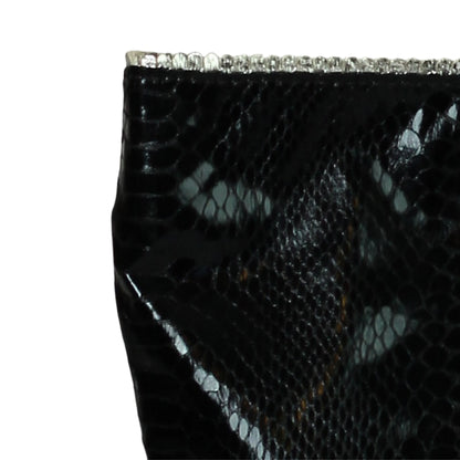 Close-up of vegan Python tote’s textured, eco-friendly jute fabric handle attachment with visible stitching detail.
