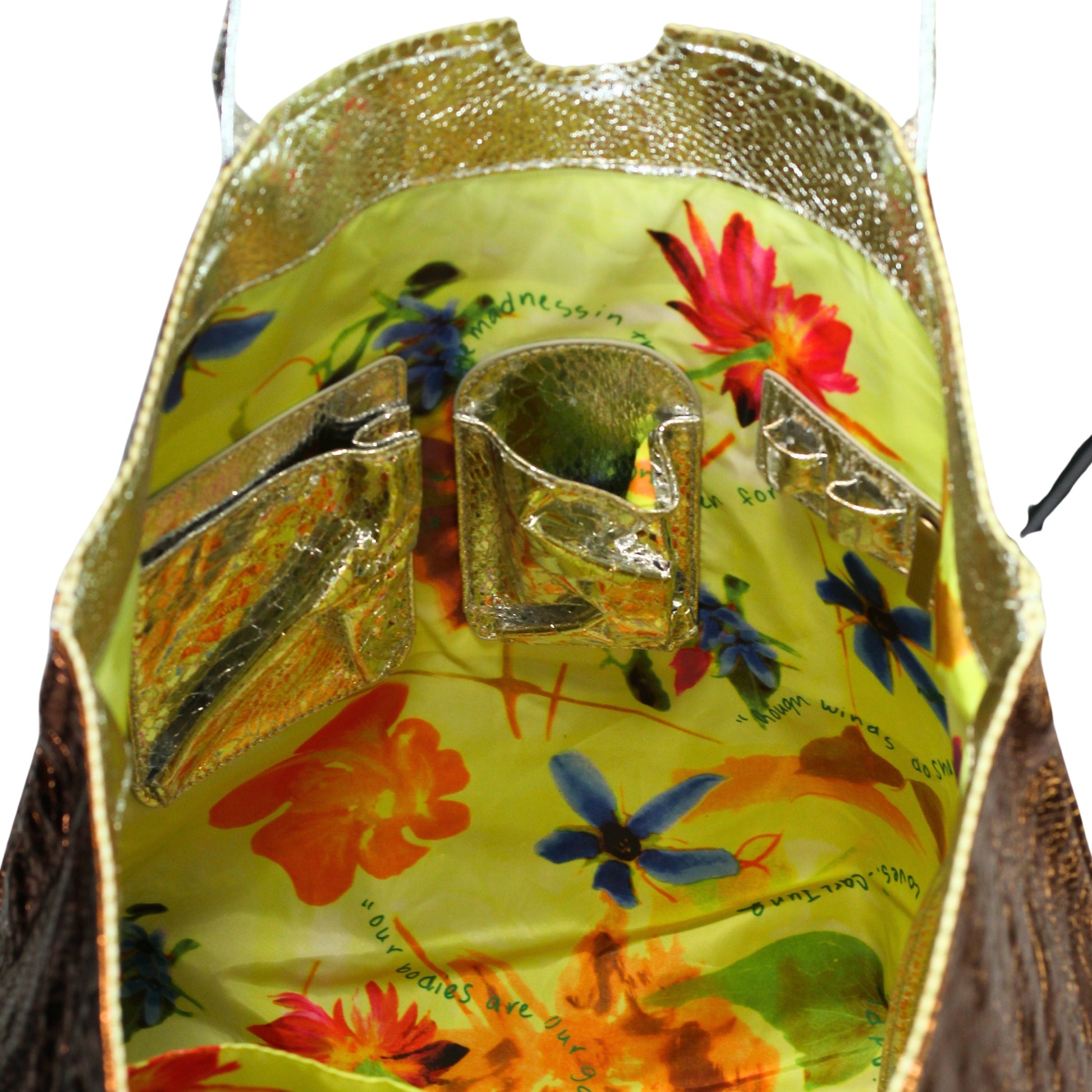 Close-up of the vegan python tote's textured, smooth cork handles sewn onto the durable, eco-friendly canvas body with