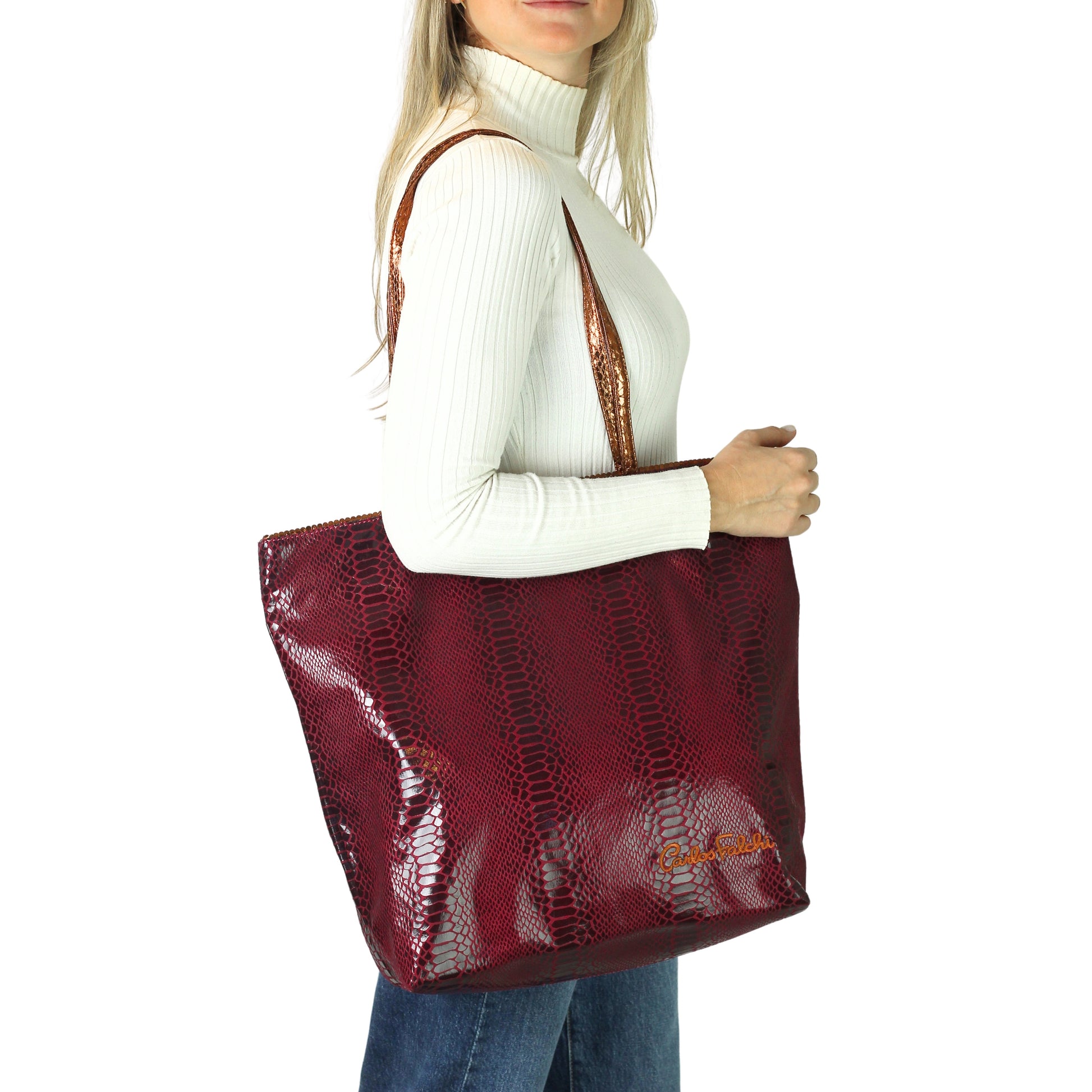 Close-up of the vegan Python Tote's textured, eco-friendly cork accents and stitched handles from a slightly elevated angle.